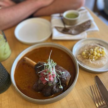Alma Fonda Fina signature dishes Queso Fundido with Lamb Chorizo, Duck Enchiladas, Carne Asada